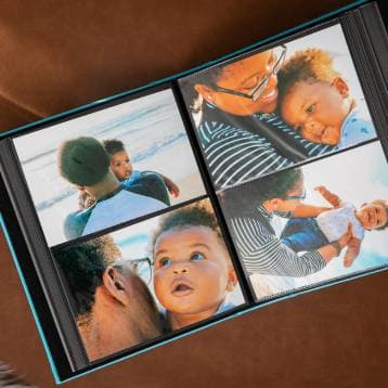 An open album filled with printed photos