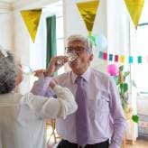 A grandfather celebrating at a birthday party